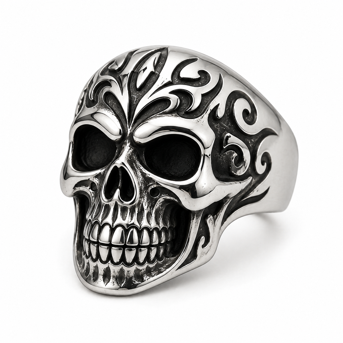 Skull jewelry collection featuring a silver-tone skull ring with intricate black tribal detailing on a clean white background