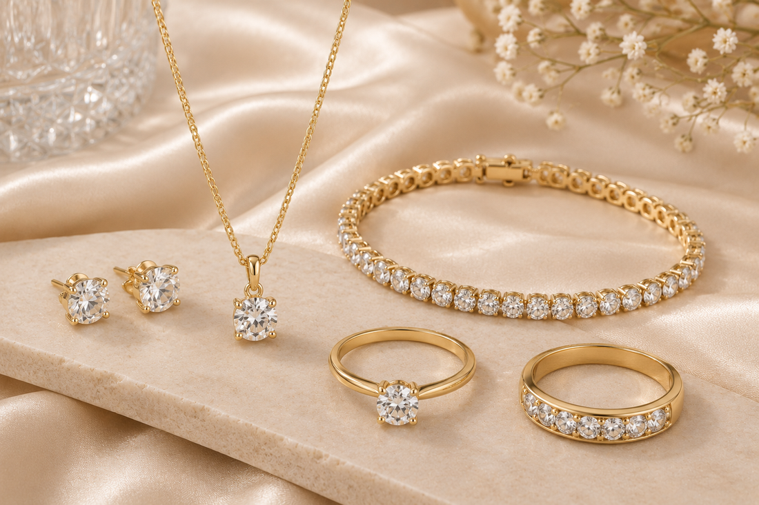 Women's classic jewelry collection featuring elegant gold earrings, pendant necklace, sparkling rings and tennis bracelet with timeless designs
