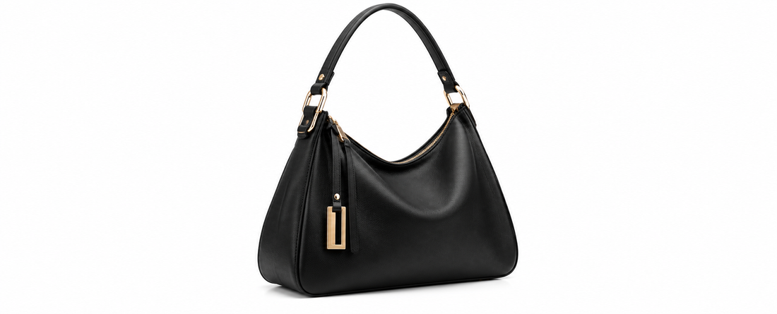 Elegant black leather handbag with gold hardware and a structured shoulder strap displayed on a clean white background.